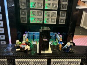 6 lego minifigures standing inside a lego z16