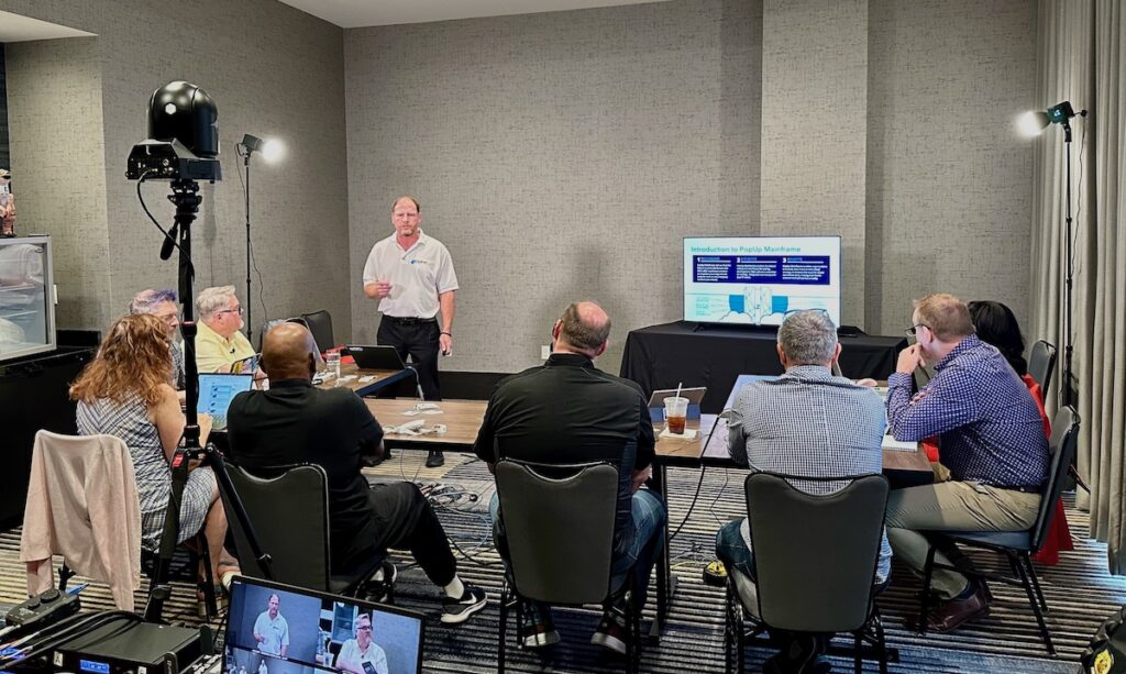 Gary presenting about PopUp Mainframe in front of 8 Tech Field Day delegates
